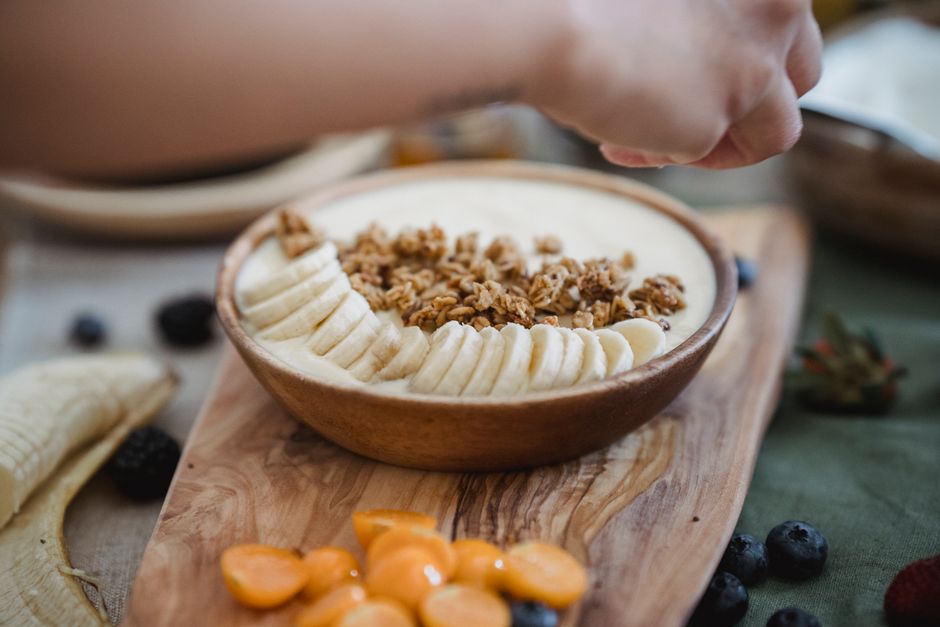 Healthy High Protein Banana Bread Recipe: Moist & Delicious 2 A close-up of ingredients including ripe bananas, oats, protein powder, and Greek yogurt arranged on a kitchen counter