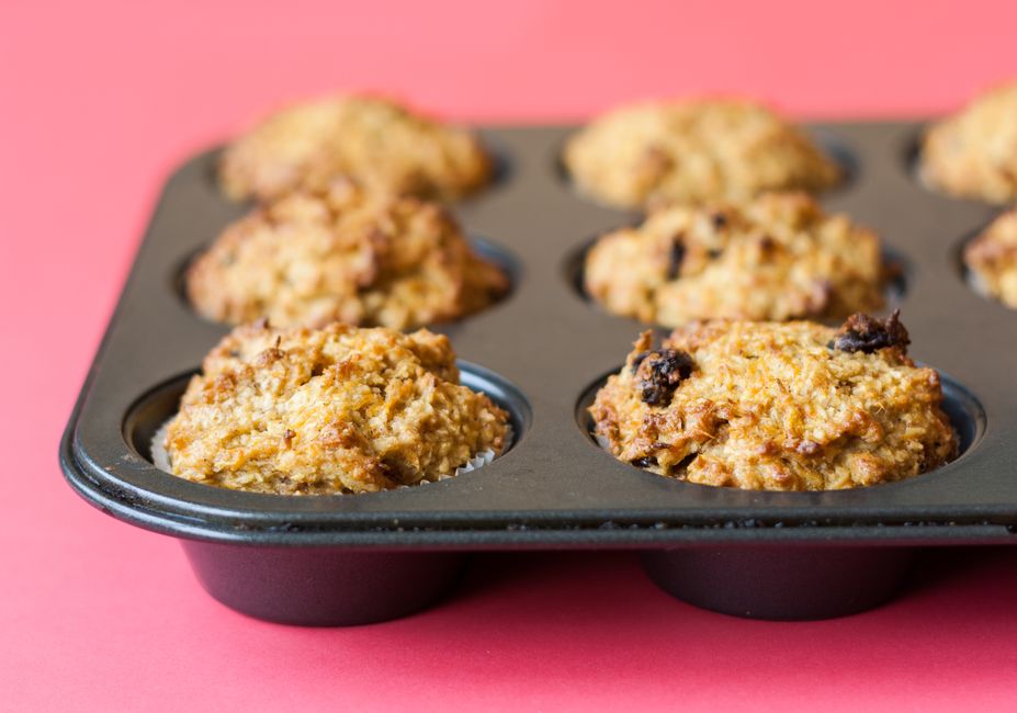 Easy Banana Bread Mini Muffins Recipe - Bite-Sized & Moist 1 A close-up shot of golden-brown banana bread mini muffins fresh out of the oven, steam gently rising.