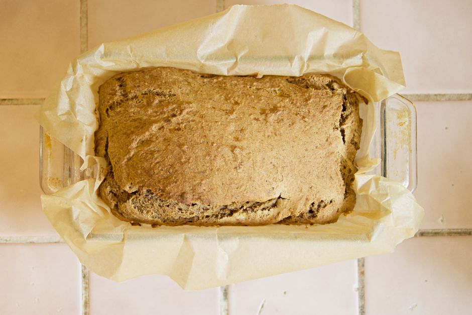 Ultimate Moist Banana Bread Recipe 8x8 Pan Guide 1 A freshly baked golden brown banana bread in a glass 8x8 square pan cooling on a wire rack