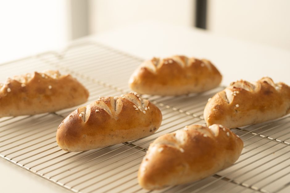 Ultimate Banana Bread Recipe King Arthur Style: Moist & Fluffy 1 A freshly baked loaf of golden-brown banana bread sitting on a wire cooling rack, with steam gently rising.