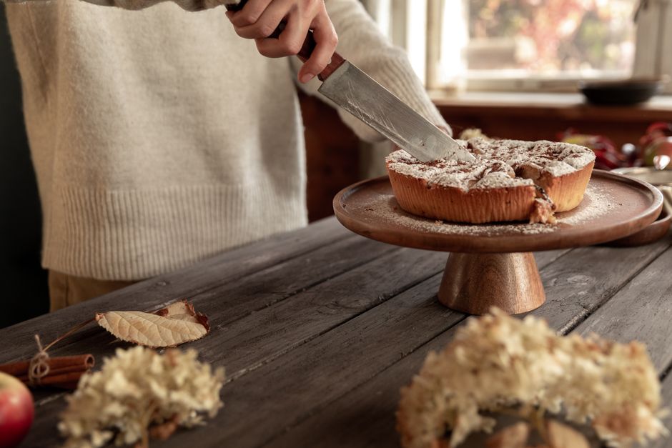 The Ultimate Birthday Celebration Guide: Heartfelt Wishes, Creative Ideas, and the Perfect Dairy Free Birthday Cake Recipe 3 A warm home kitchen with a freshly baked dairy-free cake on a stand decorated with candles