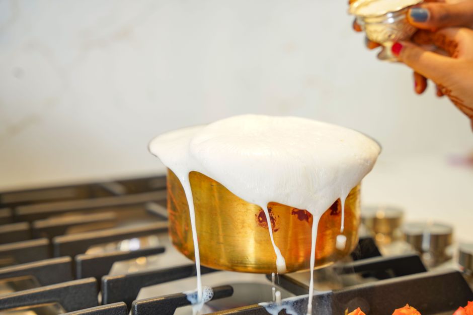 The Ultimate Brown Butter Banana Bread Recipe: Rich, Moist & Flavorful 2 Melted butter foaming and browning in a light-colored saucepan, showing the golden specks of toasted milk solids.