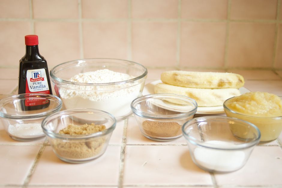 Homemade Banana Bread Coffee Syrup Recipe: Liquid Gold for Your Latte 2 Overhead shot of ingredients: overripe bananas, brown sugar, cinnamon sticks, vanilla extract, and water arranged on a wooden cutting board