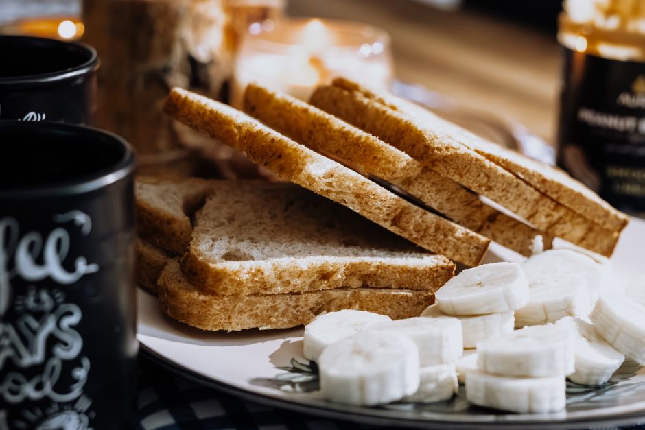 Easy Bisquick Recipe for Banana Bread: Moist & Quick Baking Guide 3 Slices of toasted banana bread arranged on a plate next to a steaming mug of black coffee.