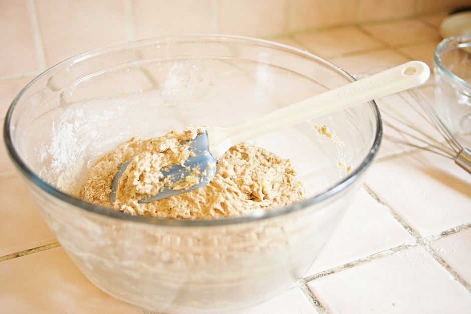 Step-by-step process of mixing wet and dry ingredients for gluten-free banana bread