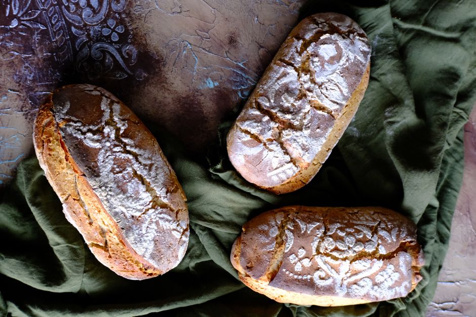 Ultimate Iced Banana Bread Recipe: Moist, Sweet, and Easy to Make 3 Three different mini loaves of banana bread, one plain, one with nuts, and one drizzled with a thick maple glaze.